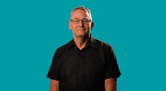 One of Berneslai Homes' Board members, Councillor Neil Young, superimposed on a light blue background.