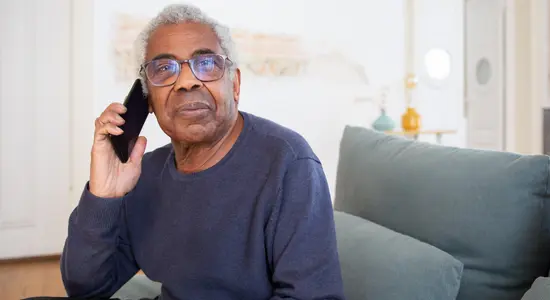An old resident on their phone.png